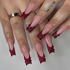 This elegant design takes the classic French manicure and gives it a Burgundy twist. The tips are painted in a deep Burgundy shade, contrasting beautifully with the soft pink base. The design is further enhanced with small bow details, adding a playful yet sophisticated element. This manicure is perfect for someone who appreciates a modern take on a timeless classic.   Photo credit by: @nailsxomari Maroon Nails, Red Acrylic Nails, Girly Acrylic Nails, French Acrylic Nails, Burgundy Nails, Long Square Acrylic Nails, Pink Acrylic Nails, Square Acrylic Nails, Luxury Nails