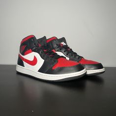 Elevate your sneaker game with these stylish Air Jordan 1 Mid Bred Toe sneakers. Crafted with a mid-top shoe shaft style, these sneakers feature a striking black, white, and fire red colorway that is sure to turn heads. The shoe is designed with a Bred Toe nickname and is part of the iconic Air Jordan product line. These sneakers are perfect for any athletic occasion and are available in a men's US shoe size 10. The Air Jordan 1 model is a classic and highly sought-after sneaker, and this particular release is set to hit the market in 2022. Don't miss out on your chance to own a piece of sneaker history. Lightly worn, no box, all flaws shown, no returns Jordan 1 Mid Bred Toe, Mid Top Shoes, Sneaker Games, Mid Top, Air Jordan 1 Mid, Jordan 1 Mid, Red Fire, Air Jordan 1, Jordan 1