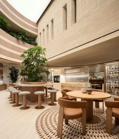 the inside of a restaurant with tables and chairs