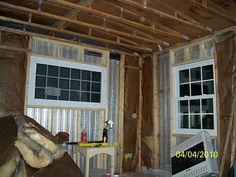 a room that is under construction with wood framing