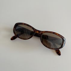 Authentic 1990s made vintage high quality frames paired with polyurethane lenses. One of a kind, rare discontinued frames with limited quantity.    Measurements: Frame width: 135mm Lens width: 51mm Lens height: 32mm Bridge: 18mm Arm temple: 140mm Shape: Rectangle  Lens : Brown Condition: New Deadstock  Lens: UV 400 High Quality Durable Style 010 Dapper Day Outfits, 90s Sunglasses, Brown Hair Inspo, Car Essentials, Dapper Day, Sunglasses Brown, Brown Lens, Tortoise Shell Sunglasses, Brown Sunglasses