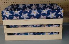 a wooden crate with blue and white stars on it