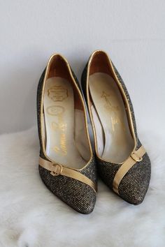 This is a vintage pair of high heel shoes. They are a deep gold/bronze tone in a metallic pattern. They also have a gold/bronze tone detail along the toe. The shoes are in good condition.Size: 5.5 NarrowInside Length: 9" | Inside Width: 3" | Outside Heel Length: 3.5" | Inside Heel Length: 2.5"Unless otherwise stated all vintage items are used and may have minor to moderate wear or discoloration considering the age of the item. Most items have been hand washed, spot cleaned, or professionally dry Gold Closed Toe Heels With Metal Feet, Gold Court Shoes With 4-inch Heel For Evening, Gold High Heel Court Shoes With 4-inch Heel, Gold Low Heel Formal Heels, Chic Gold Low Heel Court Shoes, Gold Court Shoes With 4-inch Heel And Almond Toe, Chic Gold Court Shoes With Low Heel, Gold Heels With Metal Feet For Evening, Gold High Heel Heels For Galas