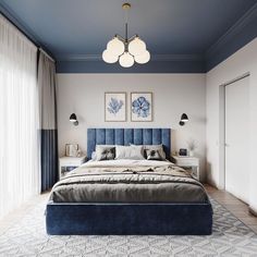 a bedroom with blue and white decor in the corner, along with two lamps on either side of the bed