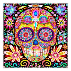 a colorful sugar skull with flowers on it