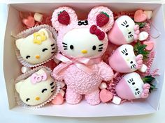 hello kitty cupcakes are arranged in a box