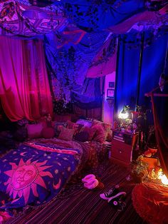 a bedroom with pink and blue lights on the ceiling, purple curtains hanging from the ceiling