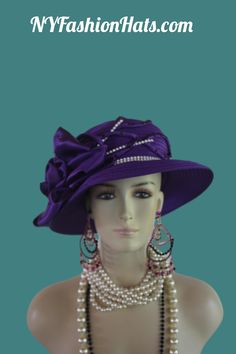 Women's Couture Designer Purple And White Brim Fashion Holiday Dress Hat. This Formal Wedding Hat Is Trimmed With A Large Purple Satin Rosette Bow Enhanced With Dark Purple Rhinestones. Satin Fabric Flowers With Dark Purple Rhinestones And White Encased Clear Rhinestone Stems Are Placed Next To The Bow. White Encased Clear Rhinestones Encircle The Crown Of This Beautiful Hat. This Elegant Dress Hat Will Make A Fashion Statement. This Statement Hat Is Custom Made And Designed By NY Fashion Hats Couture Millinery Headwear Apparel. This Hat Is Suited For Weddings, Brides, Mother Of The Bride, Church, Temple, Sabbath, Formal Affairs, Horse Races And Special Occasion Events And Gatherings. This bespoke premium quality dress hat is suited for Winter Fall And Early Spring. Material: Satin Head Si Elegant Adjustable Brimmed Bonnet, Adjustable Brimmed Elegant Bonnet, Elegant Adjustable Bonnet For Summer, Elegant Adjustable Summer Bonnet, Elegant Adjustable Bonnet For Church, Elegant Bonnet For Spring, Summer Wedding Mini Hat, Wedding And Kentucky Derby Costume Cap, Elegant Fitted Summer Bonnet