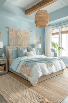 a bedroom with blue walls and white bedding, rugs on the floor and wooden headboard