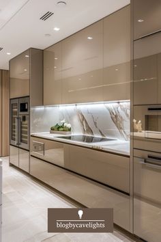 a modern kitchen with marble counter tops and stainless steel appliances