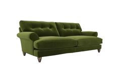 a green couch sitting on top of a white floor