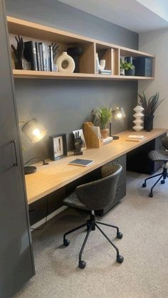 an office with a desk, chair and bookshelf in the corner next to a window