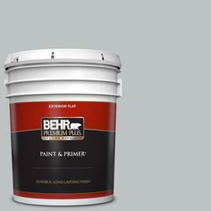 the behr ultra paint and primer in one is shown on a green background