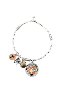 a silver bracelet with two charms and an orange tree on the front, one charmed to