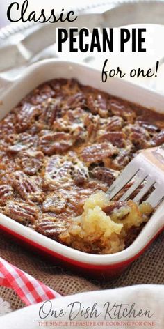 a casserole dish with pecan pie in it and a fork resting on top