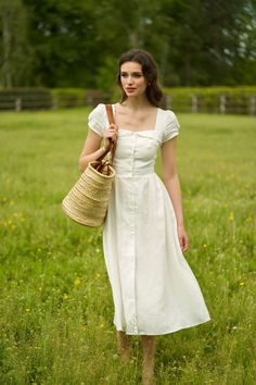 This vintage inspired midi button-down dress is crafted from sustainable linen, a lightweight fabric known for its breathability, durability, and softness. The dress features capped sleeves, feminine bust detail, and a cinched waist that gives way to a full skirt, accentuating your curves and creating a much-loved hourglass silhouette. The models measure: White, olive: 175 cm, size XS; Bright turquoise: 173 cm, size S. *All items labeled with a “P” indicate petite sizing. Sleevless White Dress, Soft Classic Feminine Style, 173cm Woman, Soft Classic Skirts, Floral Linen Dress, Housewife Outfit Modern, Catholic Dress, 40s Dresses, Midi Button Down Dress