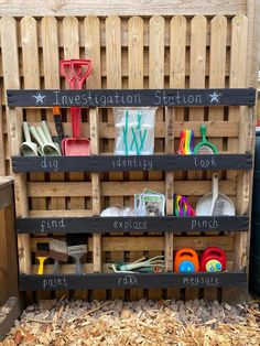 a wooden crate filled with lots of different types of utensils and other items