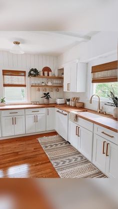 the kitchen is clean and ready for us to use it's counter tops are white