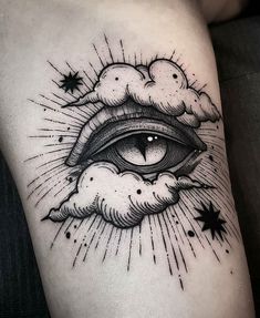 an all seeing eye with clouds and stars tattoo on the leg, done by person