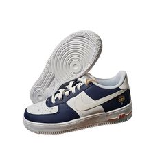 Step Up Your Sneaker Game With These Unisex Grade-School Nike Air Force 1 Lv8 (Gs) Shoes. Designed With A Low Top Shoe Shaft Style And Lace-Up Closure, These Sneakers Provide A Comfortable Fit For Any Walking, Skateboarding, Or Basketball Activity. The Navy And White Color Scheme, Along With The Royal, University, And College Themes, Make These Shoes Perfect For Any Young Sneakerhead Looking To Elevate Their Style. Crafted With Synthetic Upper Material And Cork Insole Material, These Sneakers Ar Nike Custom Sneakers, Nike Air Jordan Mid, Toddler Nike Shoes, Air Max 90 Leather, Nike Flight, Nike High Tops, Nike Shoes Jordans, Nike Tennis Shoes, White Color Scheme