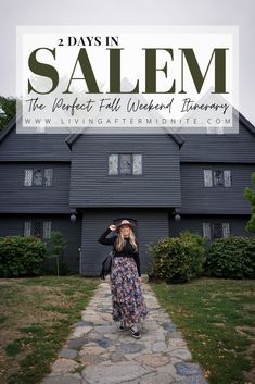 a woman standing in front of a black house with the words 2 days in salem on it