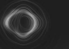 an abstract black and white photo with lines in the center, forming a circular shape