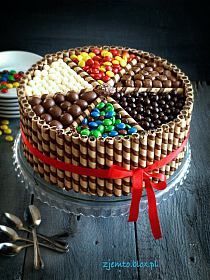 a cake with many different types of candies on it