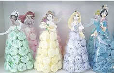 there are four princesses made out of rolled up toilet paper in the shape of roses