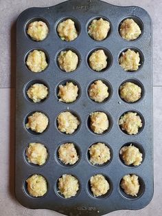 a muffin tin filled with cupcakes sitting on top of a counter