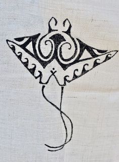 a black and white drawing of a kite on a piece of cloth with an intricate design