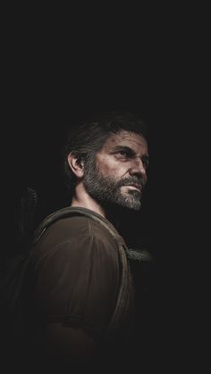 a man with a beard is standing in the dark wearing a backpack and looking off into the distance