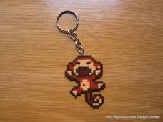 a keychain made to look like an old video game character