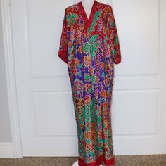 Vintage Oscar De La Renta For Swirl Red Floral Mumu Size Small? Size Tag Was Cut Out Measurements Are: Armpit To Armpit 25", Length 54" In Excellent Condition I Only Note One Faint Mark As Pictured Festive Silk Dress With Vibrant Print, Red Printed Silk Kaftan, Red Silk Dress With Printed Details, Red V-neck Kaftan With Vibrant Print, Elegant Red Floral Print Kaftan, Red Silk Dresses With Printed Details, Red Printed Silk Dresses, Silk Red Printed Dress, Festive Red Floral Print Kaftan