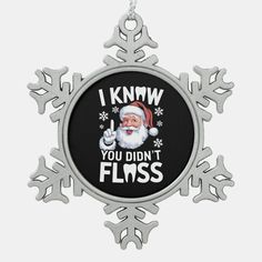 a snowflake ornament that says i know you didn't floss