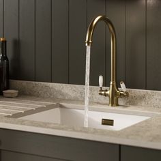 a faucet running water from a kitchen sink