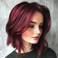 This striking cherry red lob (long bob) captures attention with its vibrant hue and textured layers. The hairstyle is characterized by its soft waves that add volume and movement, framing the face beautifully. Ideal for individuals looking to make a statement, this color and cut work well with a variety of skin tones, particularly those with fair to medium complexions, enhancing their overall glow. Lob Hairstyle For Fine Hair, Fine Hair Layers, Short Red Bob, Maroon Hair Color, Red Bob Haircut, Crimson Red Hair, Hairstyle For Fine Hair, Maroon Hair, Red Bob