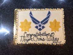 a cake with icing that says congratulations to the navy and has stars on it