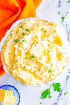 a bowl filled with mashed potatoes and cheese