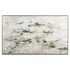 an abstract painting with black and white paint on the wall, framed in gold frame