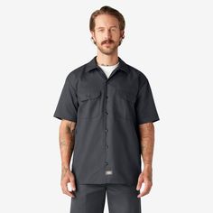 Our Men's Short Sleeve Work Shirt has been one of our top styles since Dickies started in 1922. There's a reason this style has stood the test of time. This original work shirt is crafted from our wrinkle-resistant classic twill fabric, with a generous cut through the shoulders and chest that provides freedom of movement, and square hem design for easy tucking. The piece features secure chest pockets with a pencil slot and non-break buttons. The shirt has a moisture-wicking finish to help keep you cool and dry all day long. Wear it buttoned up or over a simple tee. Dickies Shorts, Dickies Workwear, Simple Tees, Work Shirt, Work Shirts, Twill Fabric, Work Pants, Charcoal Gray, Original Work