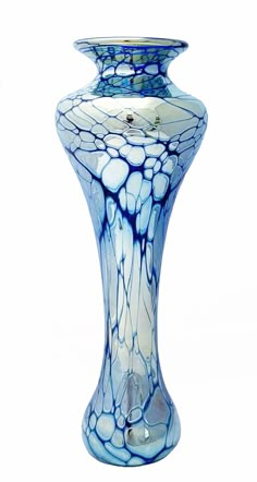 a blue and white vase sitting on top of a table