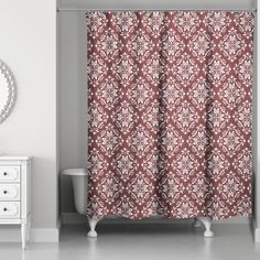 a bathroom with a sink, mirror and shower curtain in red and white color scheme