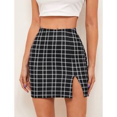 a woman wearing a black and white plaid skirt with a slit in the side,