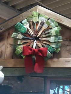 a wreath made out of money sitting on top of a mantle