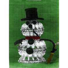 a snowman made out of ice with a top hat and cane in front of a green background