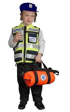 a little boy dressed as a police officer holding a water bottle and orange duffle bag