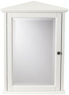 a white cabinet with a mirror in it