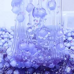 a purple vase filled with lots of bubbles