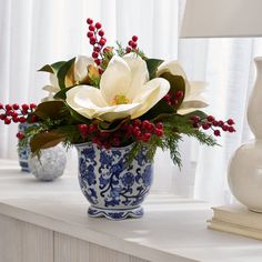 Approximate Overall Dimensions: 19" L x 19" W x 15" H Chinoiserie Jardinière Pot Dimensions:  6.75" H x 9" W x 9" D Lifelike Botanical Permanently Set Indoor Use Designed, Handcrafted in Ohio With fresh looking Christmas Greens that never fade, our Holiday Chic - Real Touch White Magnolia Blooms, Cedar Greenery & R Cedar Greenery, Fall Tabletop Decor, Christmas Stem, Chinoiserie Christmas, Southern Christmas, Chinoiserie Vase, Christmas Flower Arrangements, Bowl Vase