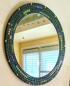 a mirror that is on the side of a wall